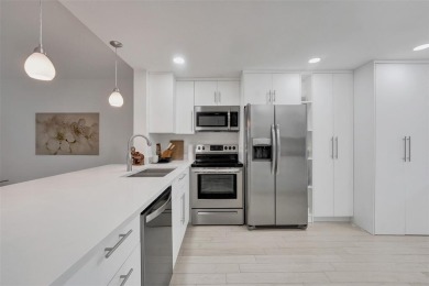 Bright and upgraded 2-bedroom 2-bath condo in a 55+ community on Oriole Golf and Tennis Club in Florida - for sale on GolfHomes.com, golf home, golf lot