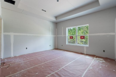 Tucked inside a gated golf community, this newly constructed on Ledgestone Country Club and Golf Course in Missouri - for sale on GolfHomes.com, golf home, golf lot