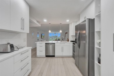Bright and upgraded 2-bedroom 2-bath condo in a 55+ community on Oriole Golf and Tennis Club in Florida - for sale on GolfHomes.com, golf home, golf lot