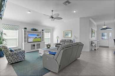 EXPANDED GARDENIA DESIGNER HOME with GOLF CAR GARAGE, LAKEFRONT on Pennbrooke Fairways in Florida - for sale on GolfHomes.com, golf home, golf lot