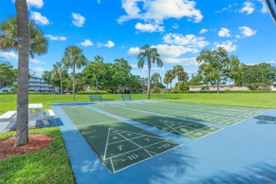 Bright and upgraded 2-bedroom 2-bath condo in a 55+ community on Oriole Golf and Tennis Club in Florida - for sale on GolfHomes.com, golf home, golf lot