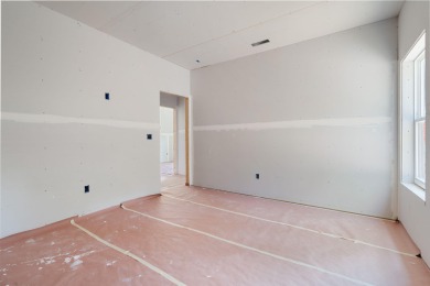 Tucked inside a gated golf community, this newly constructed on Ledgestone Country Club and Golf Course in Missouri - for sale on GolfHomes.com, golf home, golf lot