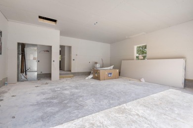 Tucked inside a gated golf community, this newly constructed on Ledgestone Country Club and Golf Course in Missouri - for sale on GolfHomes.com, golf home, golf lot