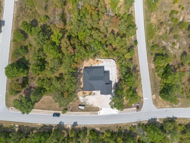 Tucked inside a gated golf community, this newly constructed on Ledgestone Country Club and Golf Course in Missouri - for sale on GolfHomes.com, golf home, golf lot