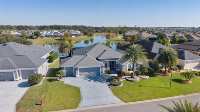 EXPANDED GARDENIA DESIGNER HOME with GOLF CAR GARAGE, LAKEFRONT on Pennbrooke Fairways in Florida - for sale on GolfHomes.com, golf home, golf lot