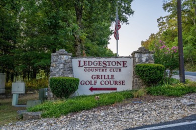 Tucked inside a gated golf community, this newly constructed on Ledgestone Country Club and Golf Course in Missouri - for sale on GolfHomes.com, golf home, golf lot