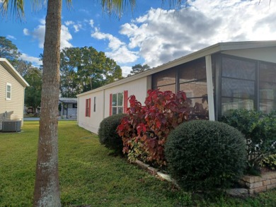 Come settle down and relax in a beautiful manufactured home with on Fairways Country Club in Florida - for sale on GolfHomes.com, golf home, golf lot