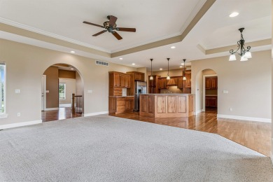 Situated on hole #4 at River Ridge Golf Course, this stunning on River Ridge Golf Club in Iowa - for sale on GolfHomes.com, golf home, golf lot