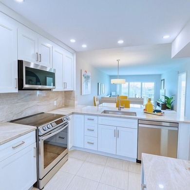 Experience turnkey luxury in this completely redesigned on Palm-Aire Country Club and Resort - The Oaks in Florida - for sale on GolfHomes.com, golf home, golf lot