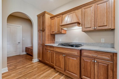 Situated on hole #4 at River Ridge Golf Course, this stunning on River Ridge Golf Club in Iowa - for sale on GolfHomes.com, golf home, golf lot