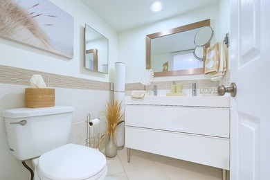 Experience turnkey luxury in this completely redesigned on Palm-Aire Country Club and Resort - The Oaks in Florida - for sale on GolfHomes.com, golf home, golf lot