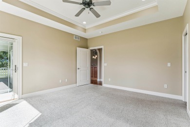 Situated on hole #4 at River Ridge Golf Course, this stunning on River Ridge Golf Club in Iowa - for sale on GolfHomes.com, golf home, golf lot