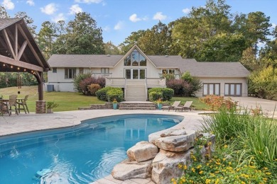 Welcome to a sophisticated retreat with a lodge-inspired charm on Quail Hallow Golf Course in Mississippi - for sale on GolfHomes.com, golf home, golf lot