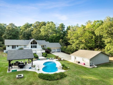 Welcome to a sophisticated retreat with a lodge-inspired charm on Quail Hallow Golf Course in Mississippi - for sale on GolfHomes.com, golf home, golf lot