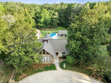 Welcome to a sophisticated retreat with a lodge-inspired charm on Quail Hallow Golf Course in Mississippi - for sale on GolfHomes.com, golf home, golf lot