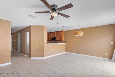 This condo features two bedrooms each with their own private on Golf Club At Fleming Island in Florida - for sale on GolfHomes.com, golf home, golf lot