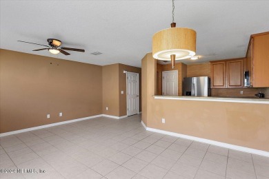 This condo features two bedrooms each with their own private on Golf Club At Fleming Island in Florida - for sale on GolfHomes.com, golf home, golf lot