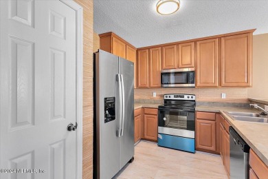 This condo features two bedrooms each with their own private on Golf Club At Fleming Island in Florida - for sale on GolfHomes.com, golf home, golf lot