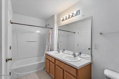 This condo features two bedrooms each with their own private on Golf Club At Fleming Island in Florida - for sale on GolfHomes.com, golf home, golf lot