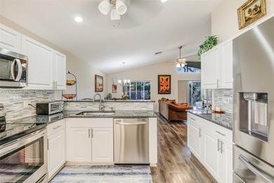 Welcome to this bright and inviting 3BR/2BA residence in the on Westchester Golf and Country Club in Florida - for sale on GolfHomes.com, golf home, golf lot