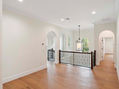 One or more photo(s) has been virtually staged. Nestled along on Lake Nona Golf Club, Inc. in Florida - for sale on GolfHomes.com, golf home, golf lot
