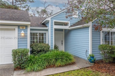 This exceptional residence boasts a spacious two-car garage and on Okatie Creek Golf Club in South Carolina - for sale on GolfHomes.com, golf home, golf lot