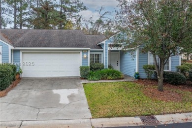 This exceptional residence boasts a spacious two-car garage and on Okatie Creek Golf Club in South Carolina - for sale on GolfHomes.com, golf home, golf lot