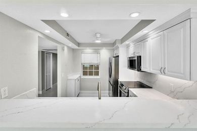 FULLY renovated second-floor 3-bedroom, 2-bath home combining on Palm-Aire Country Club and Resort - The Oaks in Florida - for sale on GolfHomes.com, golf home, golf lot