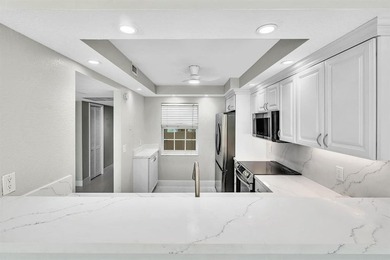 FULLY renovated second-floor 3-bedroom, 2-bath home combining on Palm-Aire Country Club and Resort - The Oaks in Florida - for sale on GolfHomes.com, golf home, golf lot