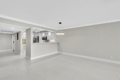 FULLY renovated second-floor 3-bedroom, 2-bath home combining on Palm-Aire Country Club and Resort - The Oaks in Florida - for sale on GolfHomes.com, golf home, golf lot