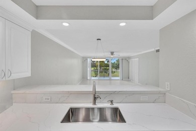 FULLY renovated second-floor 3-bedroom, 2-bath home combining on Palm-Aire Country Club and Resort - The Oaks in Florida - for sale on GolfHomes.com, golf home, golf lot