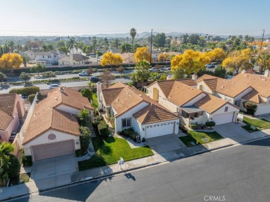 This darling home adorns a winding street in the tightly-knit on Menifee Lakes Country Club - Lakes in California - for sale on GolfHomes.com, golf home, golf lot