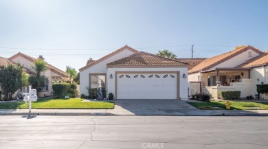 This darling home adorns a winding street in the tightly-knit on Menifee Lakes Country Club - Lakes in California - for sale on GolfHomes.com, golf home, golf lot