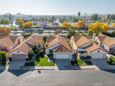 This darling home adorns a winding street in the tightly-knit on Menifee Lakes Country Club - Lakes in California - for sale on GolfHomes.com, golf home, golf lot