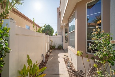 This darling home adorns a winding street in the tightly-knit on Menifee Lakes Country Club - Lakes in California - for sale on GolfHomes.com, golf home, golf lot