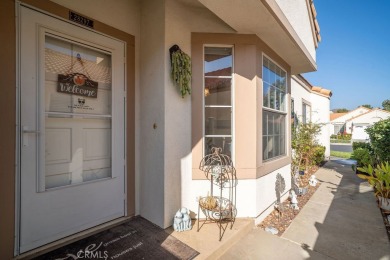 This darling home adorns a winding street in the tightly-knit on Menifee Lakes Country Club - Lakes in California - for sale on GolfHomes.com, golf home, golf lot