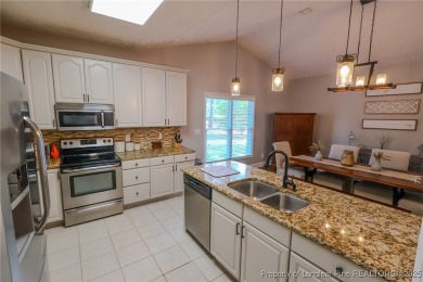 Welcome to this charming ranch home in the highly sought-after on Gates Four Golf and Country Club in North Carolina - for sale on GolfHomes.com, golf home, golf lot