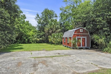 This jewel of a house in Old Town Bay Saint Louis  sits on over on The Bridges Golf Club At Hollywood Casino in Mississippi - for sale on GolfHomes.com, golf home, golf lot