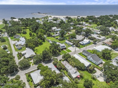 This jewel of a house in Old Town Bay Saint Louis  sits on over on The Bridges Golf Club At Hollywood Casino in Mississippi - for sale on GolfHomes.com, golf home, golf lot