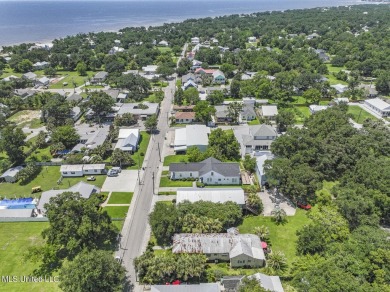 This jewel of a house in Old Town Bay Saint Louis  sits on over on The Bridges Golf Club At Hollywood Casino in Mississippi - for sale on GolfHomes.com, golf home, golf lot