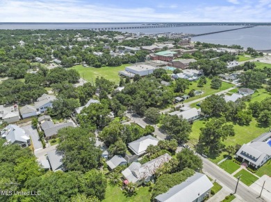 This jewel of a house in Old Town Bay Saint Louis  sits on over on The Bridges Golf Club At Hollywood Casino in Mississippi - for sale on GolfHomes.com, golf home, golf lot