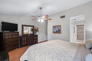 This home is nestled in the active gated community of Boca on Boca Delray Golf and Country Club in Florida - for sale on GolfHomes.com, golf home, golf lot