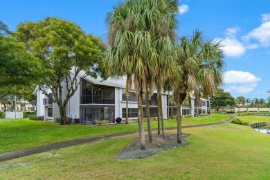 This home is nestled in the active gated community of Boca on Boca Delray Golf and Country Club in Florida - for sale on GolfHomes.com, golf home, golf lot