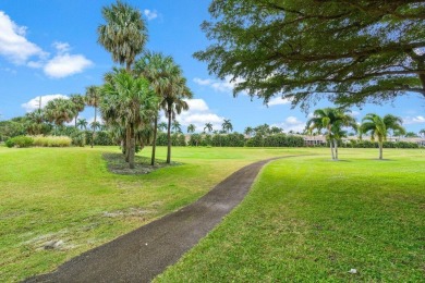 This home is nestled in the active gated community of Boca on Boca Delray Golf and Country Club in Florida - for sale on GolfHomes.com, golf home, golf lot
