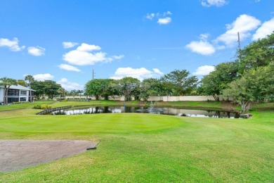 This home is nestled in the active gated community of Boca on Boca Delray Golf and Country Club in Florida - for sale on GolfHomes.com, golf home, golf lot