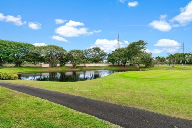 This home is nestled in the active gated community of Boca on Boca Delray Golf and Country Club in Florida - for sale on GolfHomes.com, golf home, golf lot