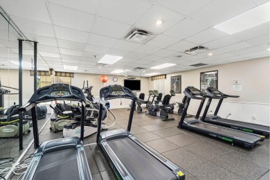 This home is nestled in the active gated community of Boca on Boca Delray Golf and Country Club in Florida - for sale on GolfHomes.com, golf home, golf lot