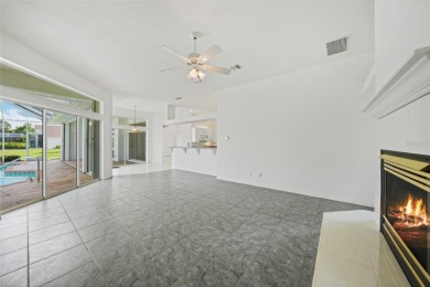 Explore this EXPANSIVE residence featuring a SPLIT BEDROOM on Pinemoor West Golf Club in Florida - for sale on GolfHomes.com, golf home, golf lot