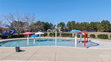Inviting and charming, the rocking-chair brick front porch on Reunion Golf Club in Georgia - for sale on GolfHomes.com, golf home, golf lot