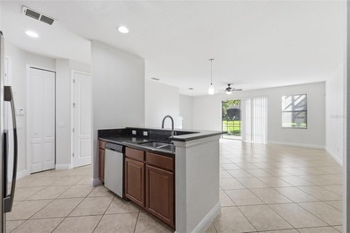 Experience luxury living in this stunning 3-bedroom, 2.5-bath on Eagle Creek Golf Club in Florida - for sale on GolfHomes.com, golf home, golf lot